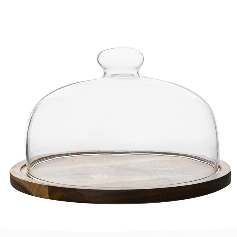 Wood cake plate with a clear glass dome on a white background