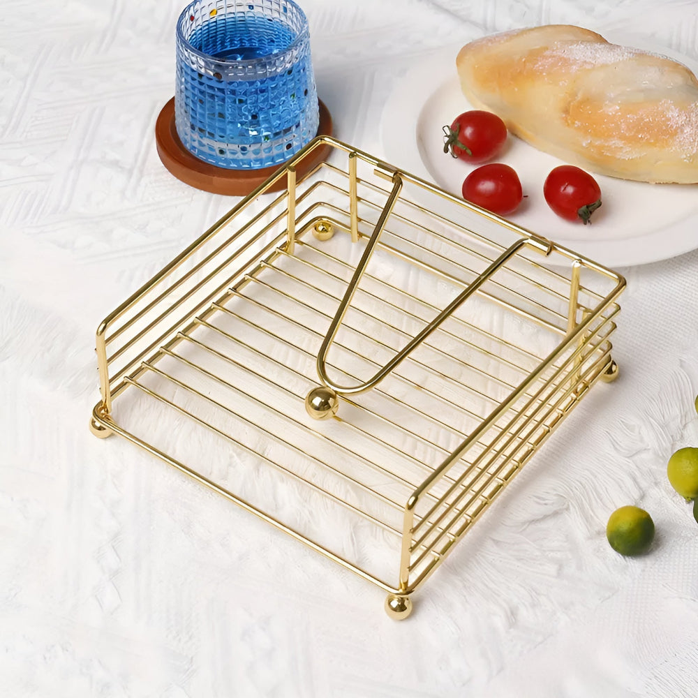 Gold wire napkin holder on a breakfast table