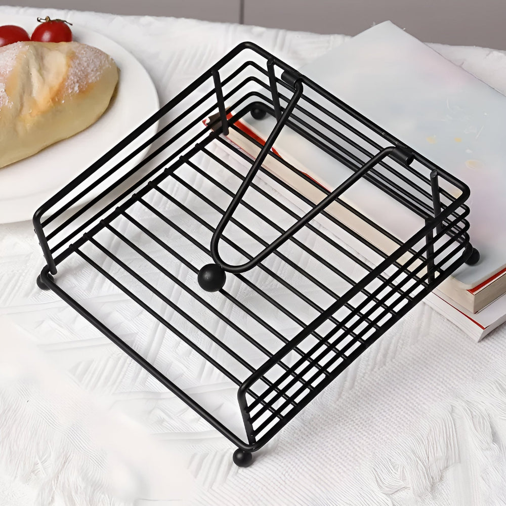 Empty black wire napkin holder with the arm lowered