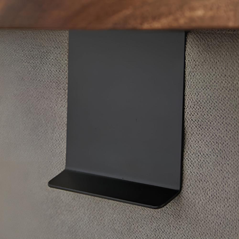 Black metal bracket of the sofa arm tray on the armrest