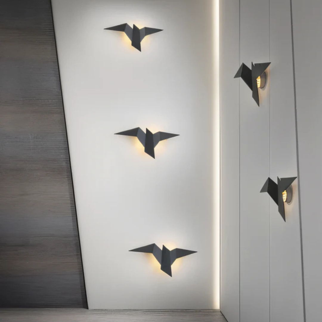 Origami bird wall light with a warm white glow