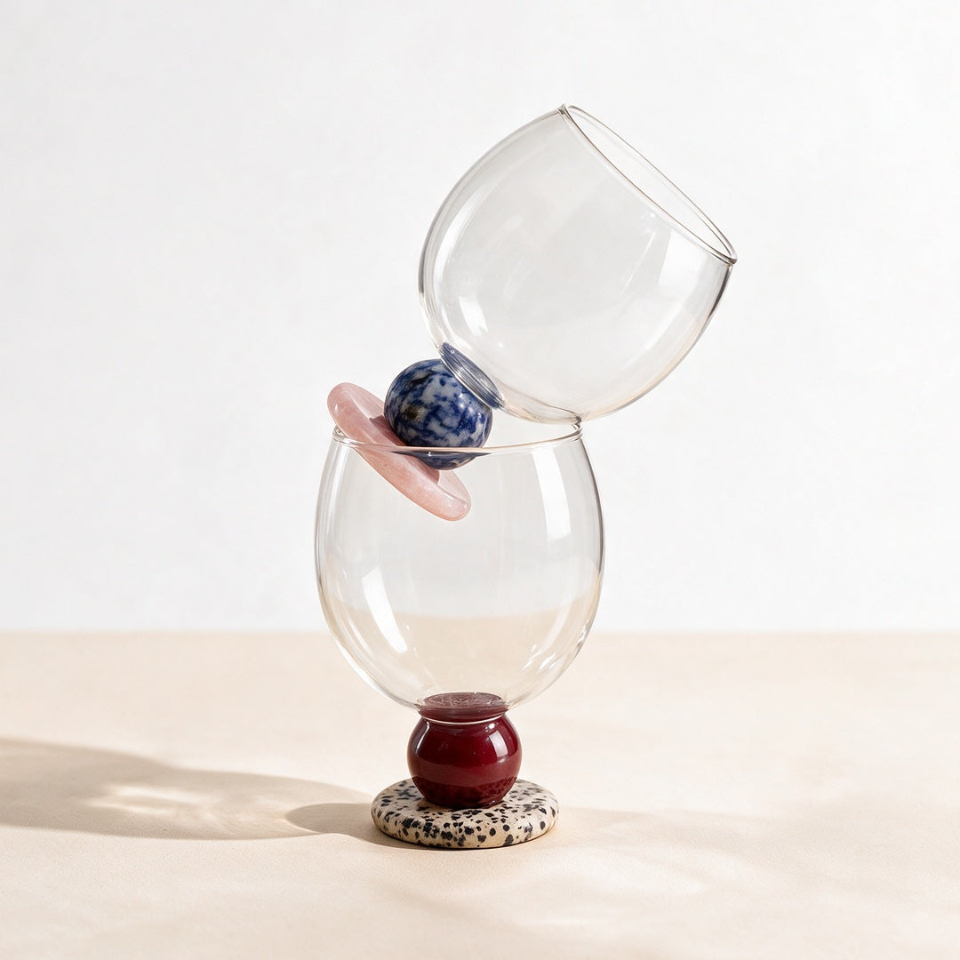 Two stone base drinking glasses, one resting on top of the other