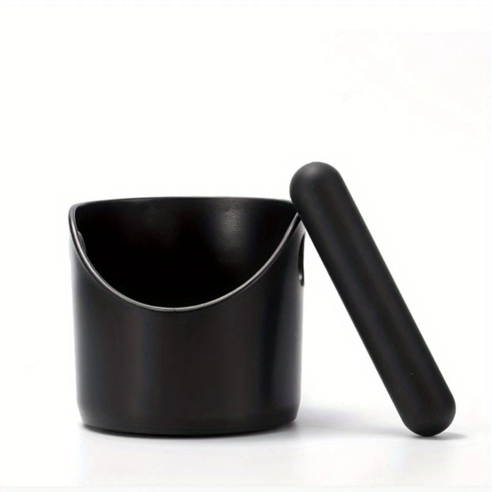 Black espresso knock box with the knock bar lifted out
