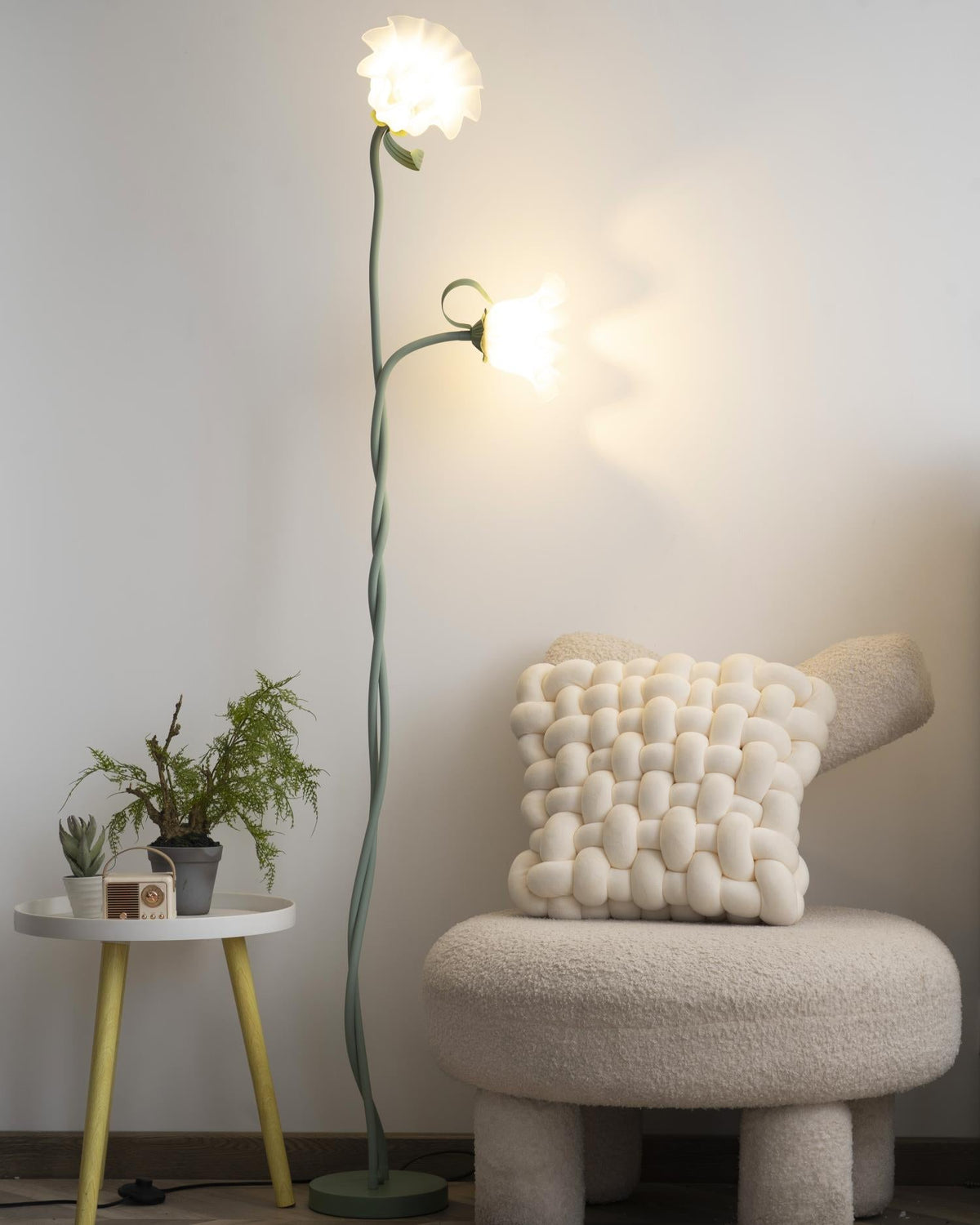 Calla lily floor lamp, green stem white shades - lit at dusk, warm light