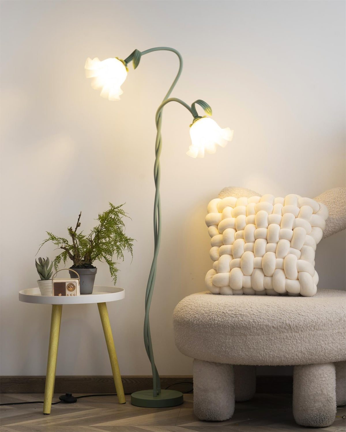 Calla lily floor lamp, green stem white shades - above a dining table, warm light