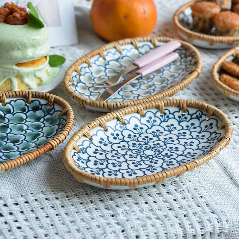 Oval serving plates with pastries on a table set for guests