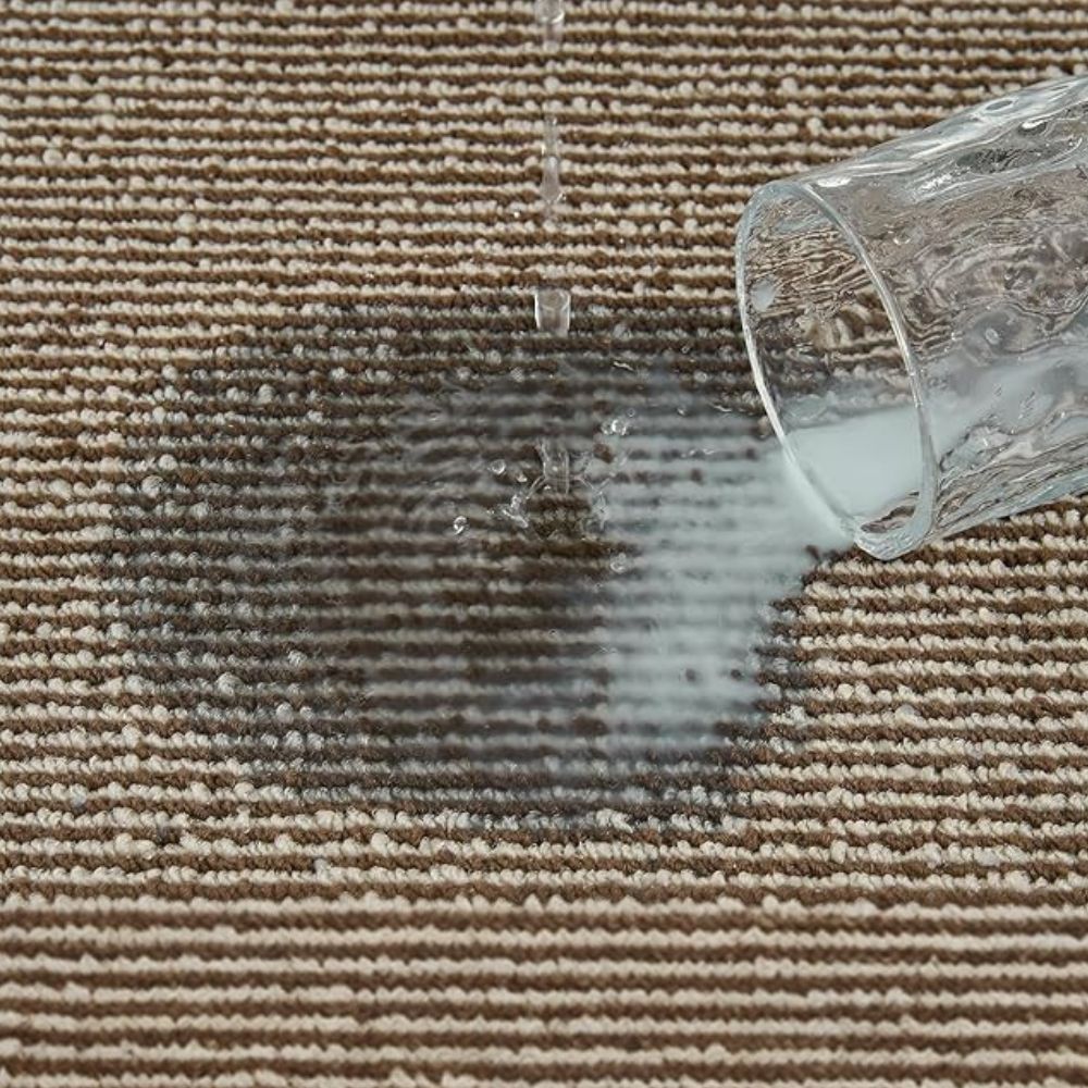 Water poured on the woven surface of the Strata kitchen rug