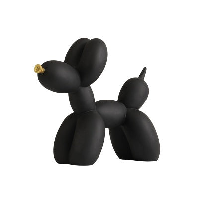 Black matte balloon dog sculpture on a white background