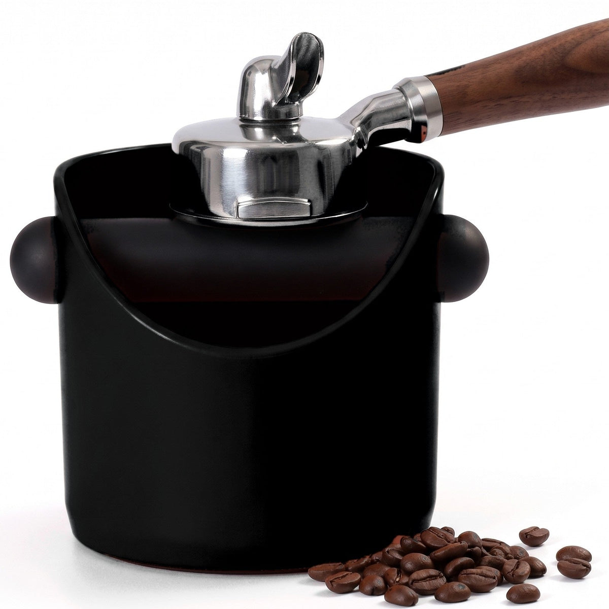 Brew espresso knock box in Matte Black with a portafilter tapping on the knock bar