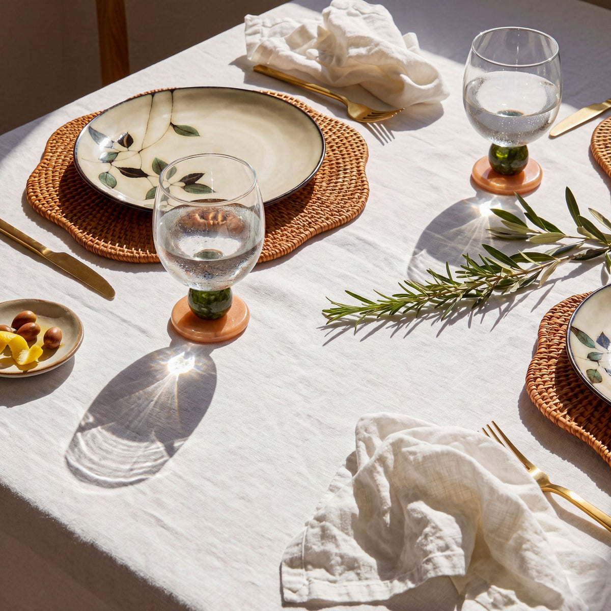 Table set with a patterned plate and a stone base glass