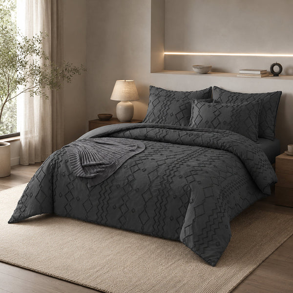 Velaro Noir bedding set in dark gray on a neatly made bed