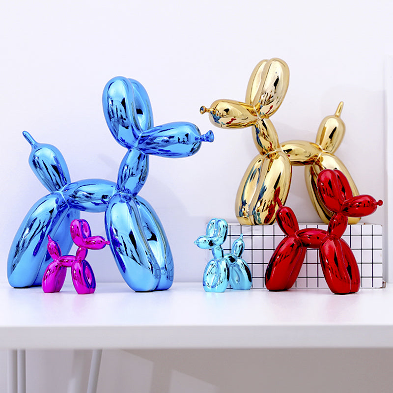 Glossy balloon dog sculptures in several colors on a shelf