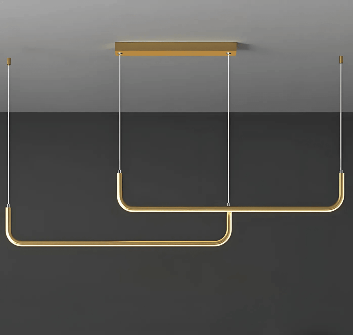 Gold two bar Dumont linear pendant light on a gray wall