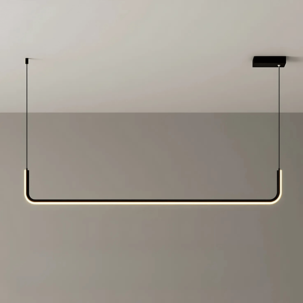 Black single bar Dumont linear pendant light on a gray wall