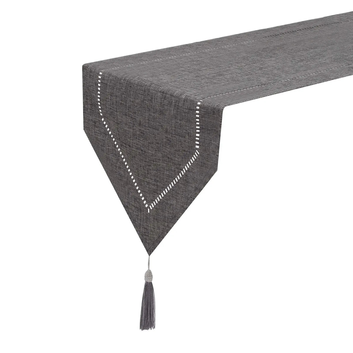 Gray hemstitched table runner draped over a table edge with tassel