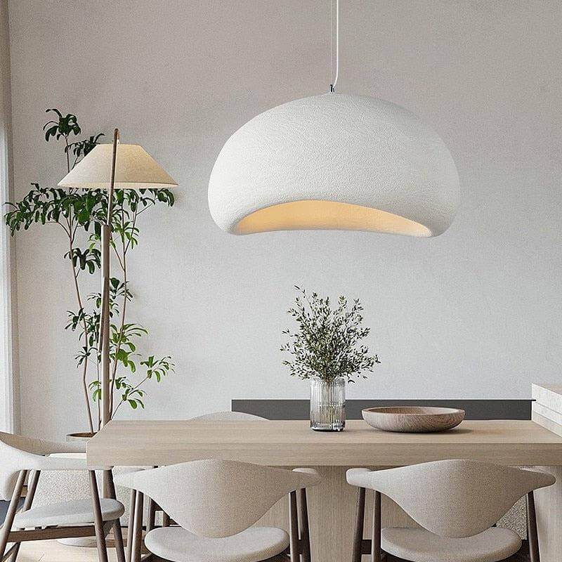 White Ginza pendant light over a dining table with a floor lamp