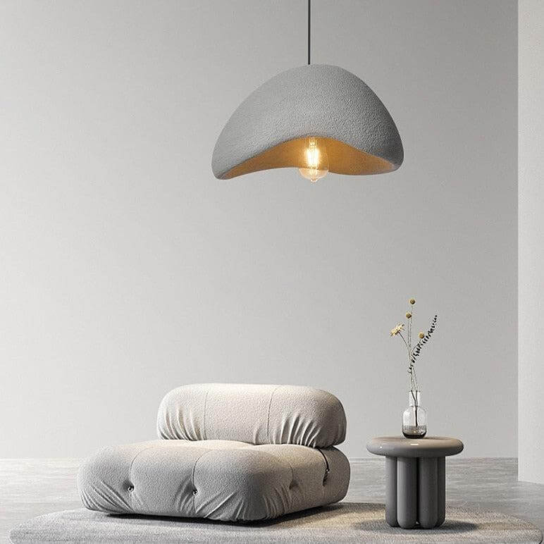 Gray Ginza pendant light above a lounge chair
