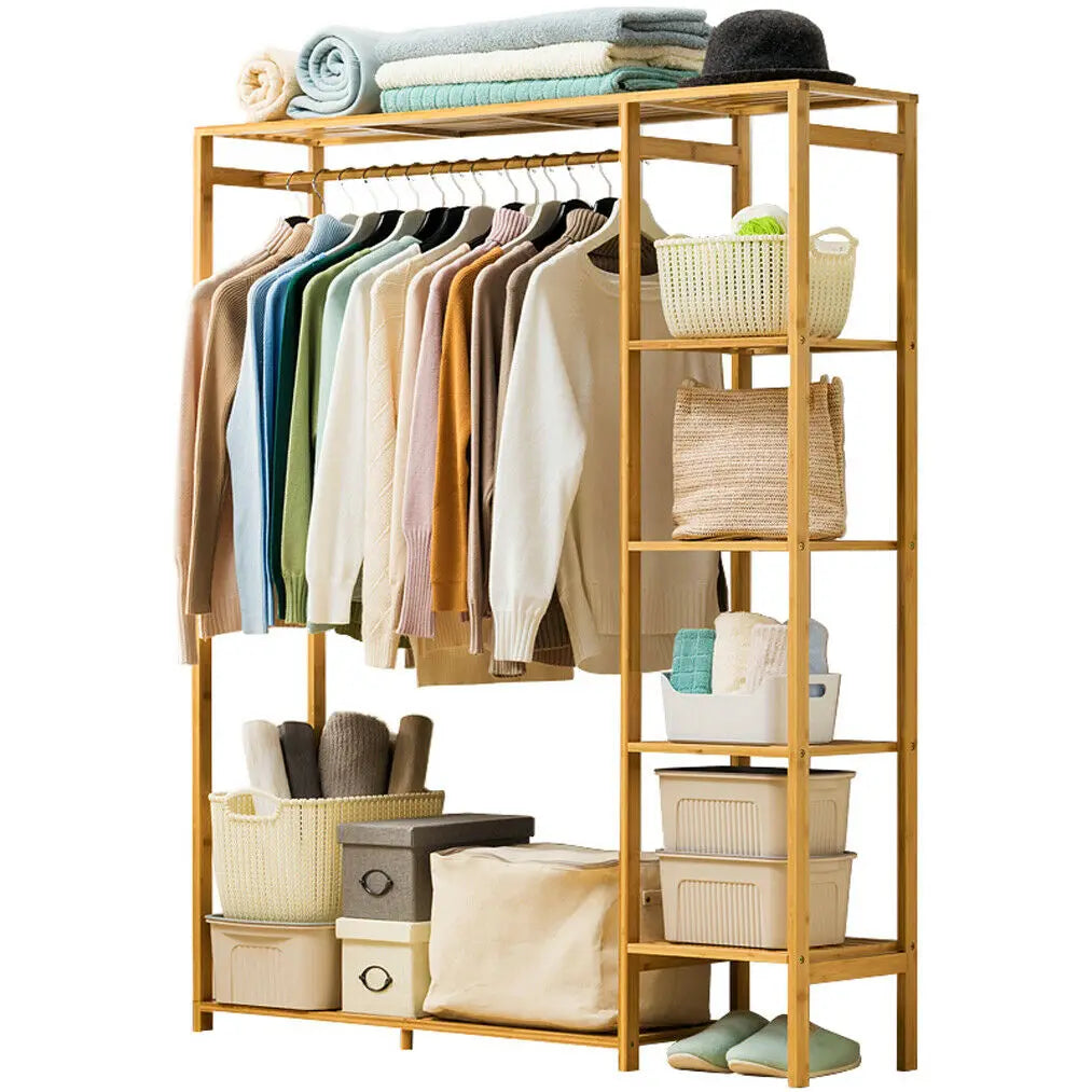 Bamboo open wardrobe with clothes, baskets and boxes on a white background