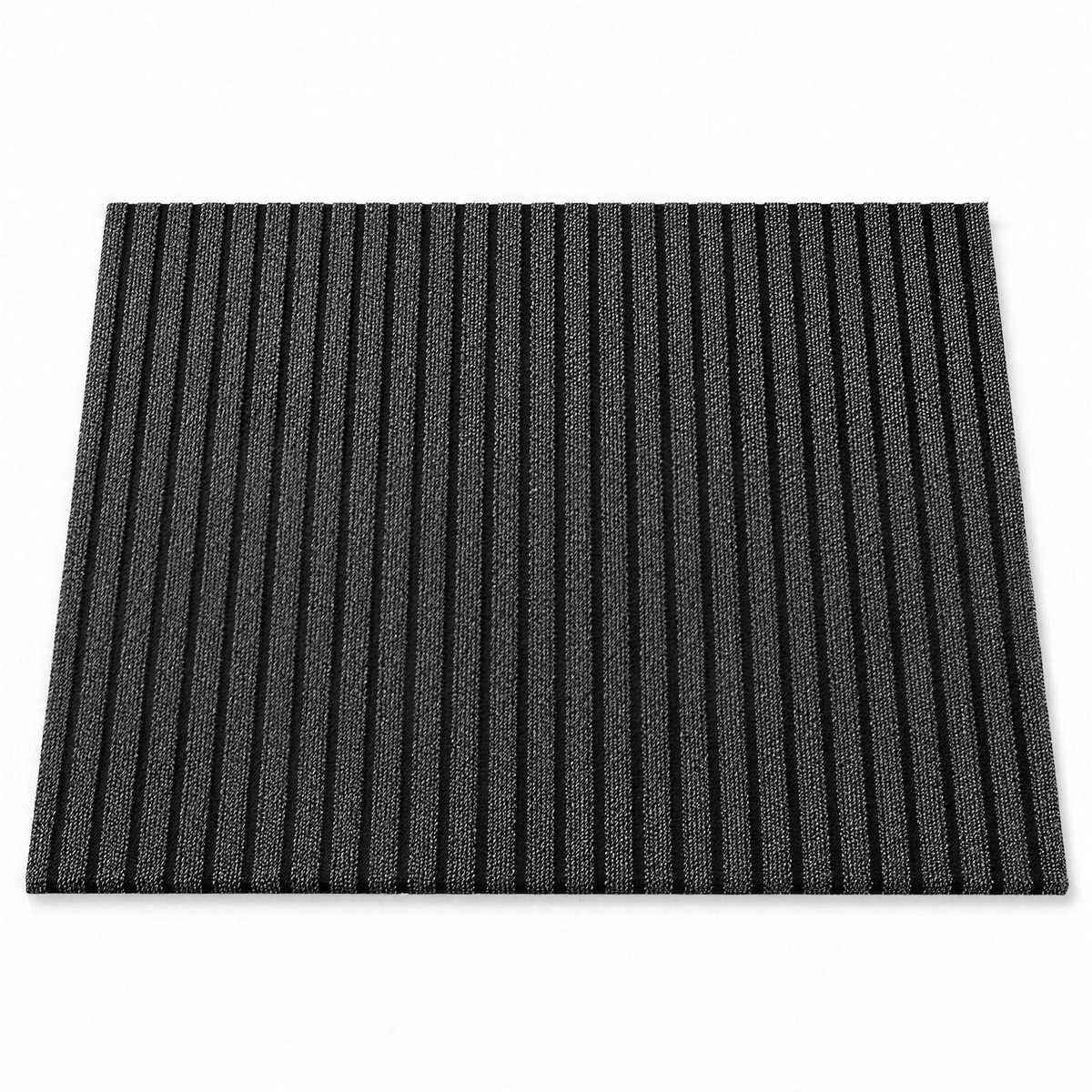 Ribbed outdoor door mat close up, fine speckled texture and raised ridges