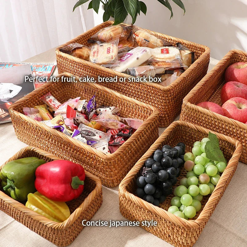 Rattan baskets filled with snacks, fruit and vegetables on a table