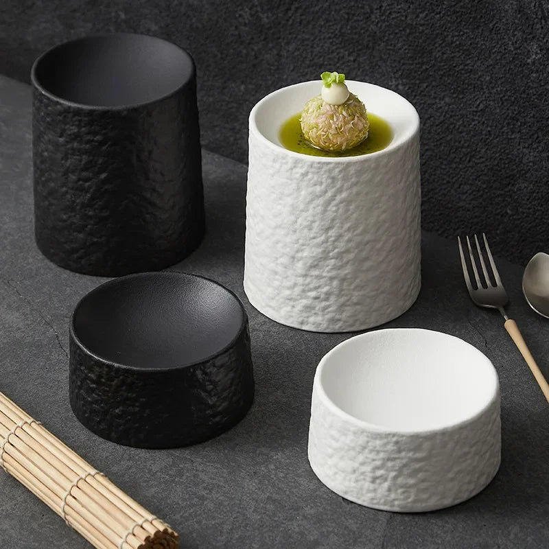 Black and white textured pedestal dishes in two heights together