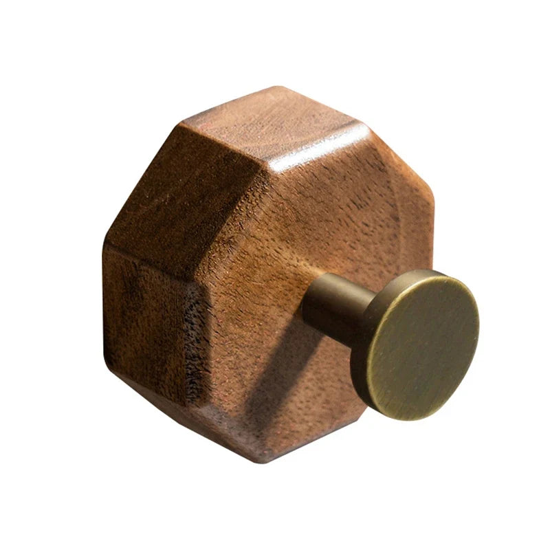 Walnut octagon wall hook with an antique brass finish peg