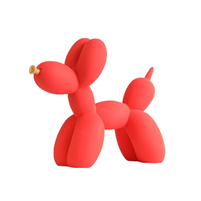 Red matte balloon dog sculpture on a white background
