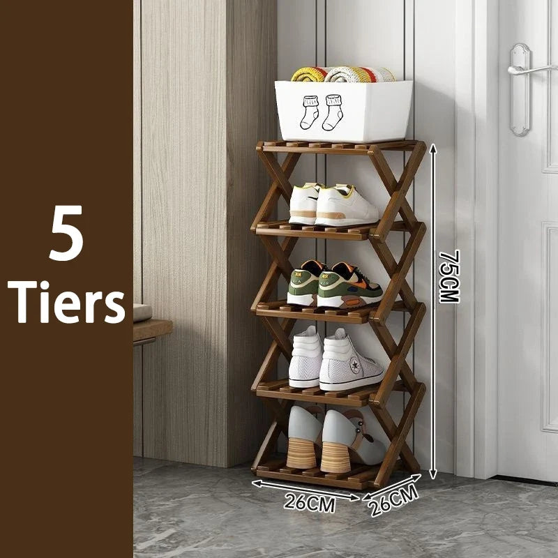 Five tier brown bamboo shoe rack holding sneakers next to a door