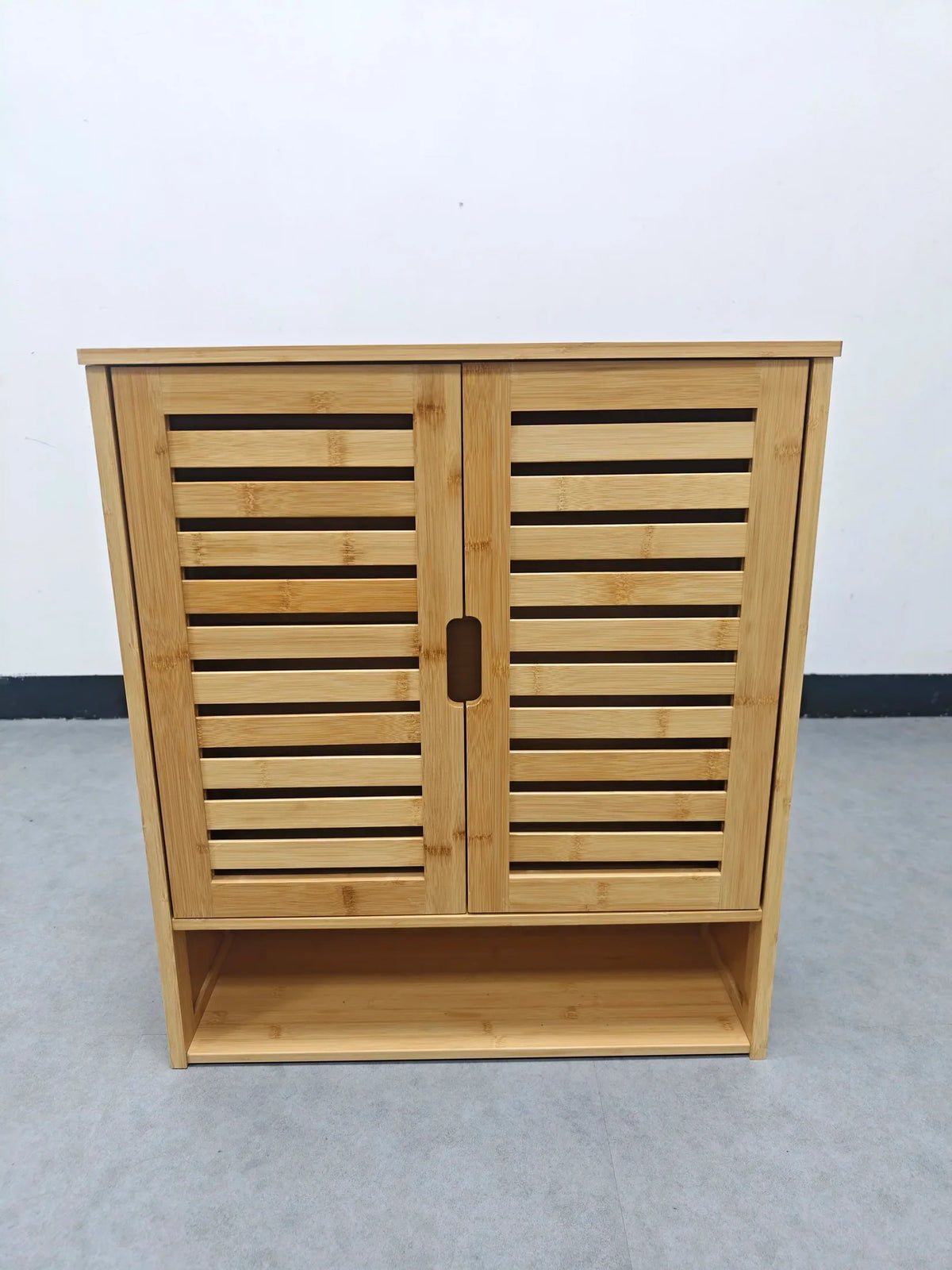 Front view of the bamboo wall cabinet with both louvered doors closed