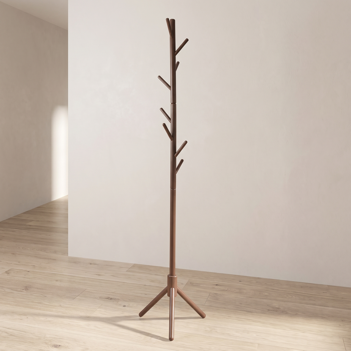 Dark brown wood coat stand on three splayed tripod legs