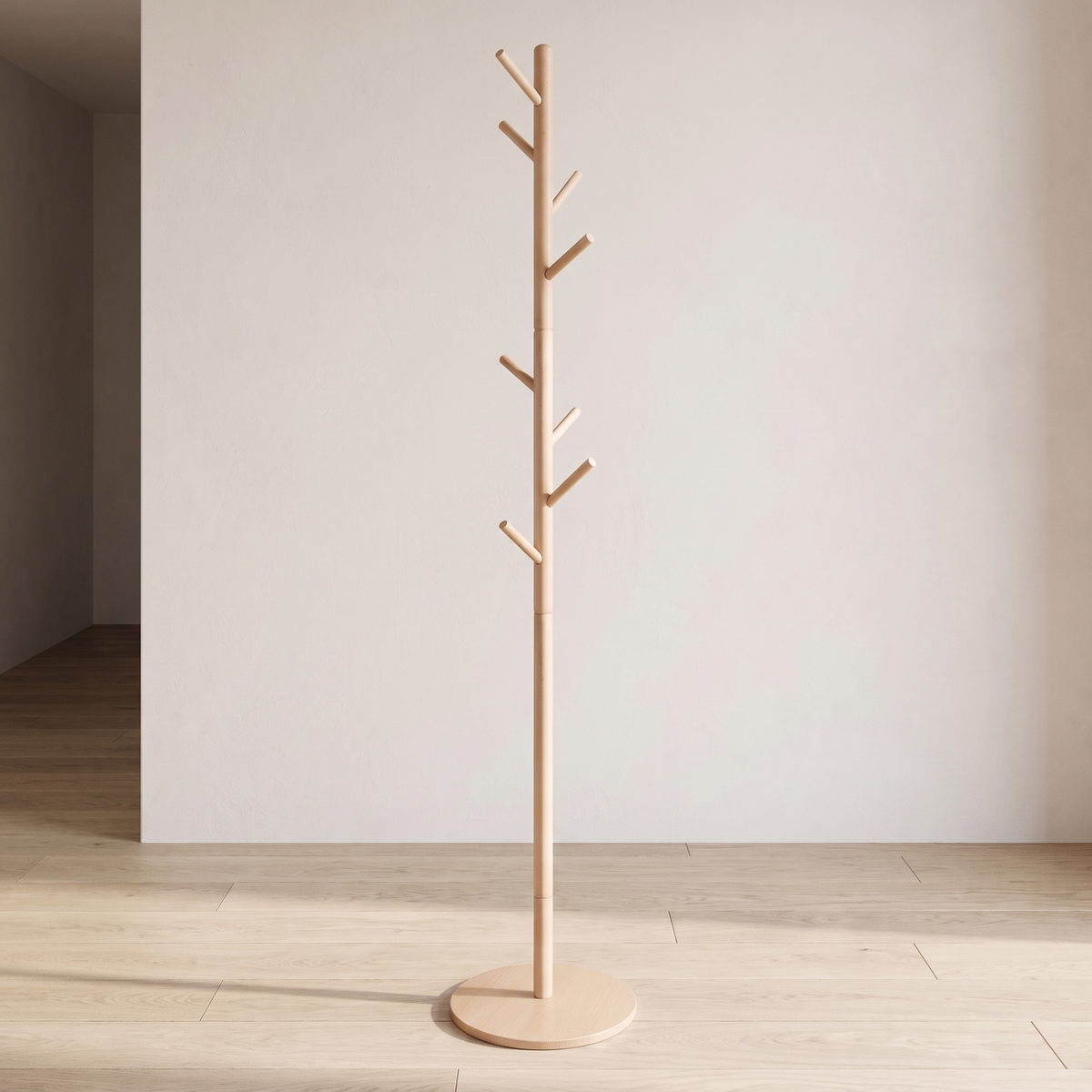 Natural wood coat stand with eight hooks on a round base in an empty room