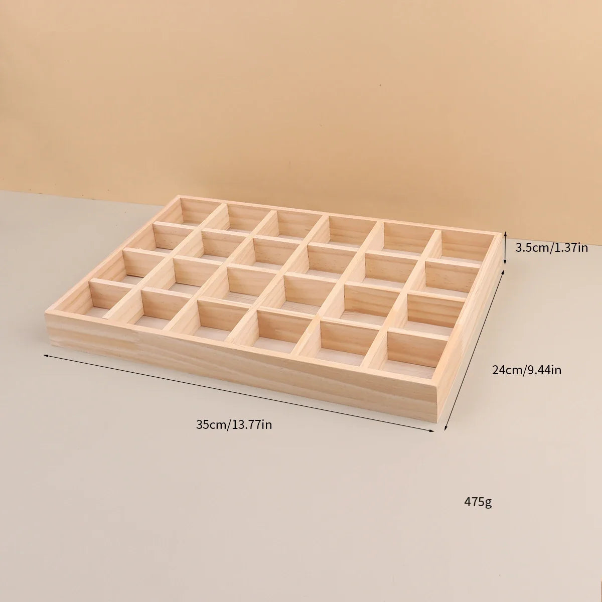 Empty 24 compartment wooden tray at an angle with size lines