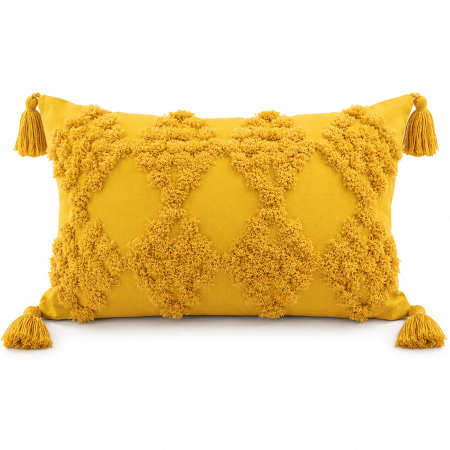 Yellow lumbar tufted throw pillow with tassel trim in cotton canvas