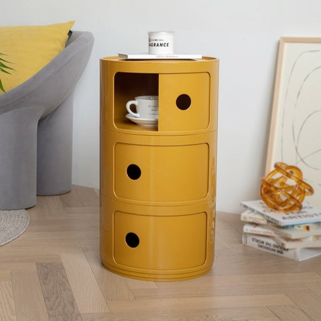 Turmeric three tier round storage unit with an open door in a living room