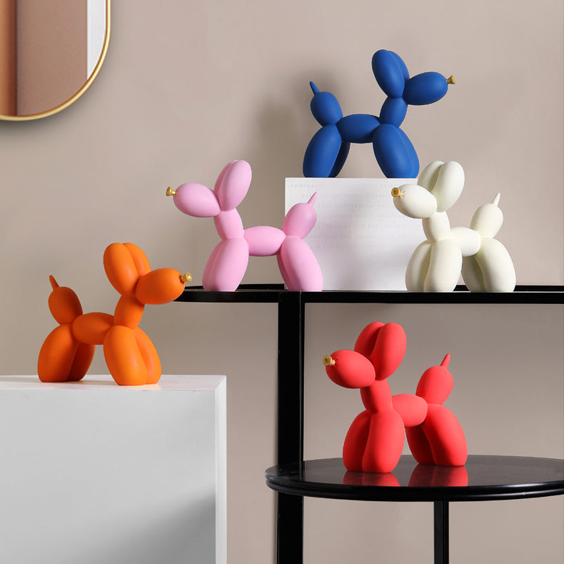 Matte balloon dog sculptures in several colors on black shelves