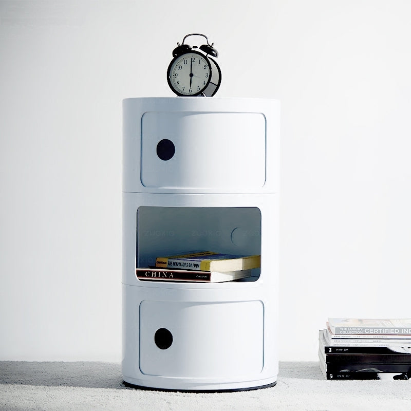 White three tier round storage unit with a clock on top