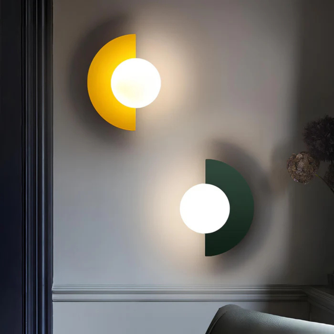 Lyca globe wall sconce with a G9 LED bulb