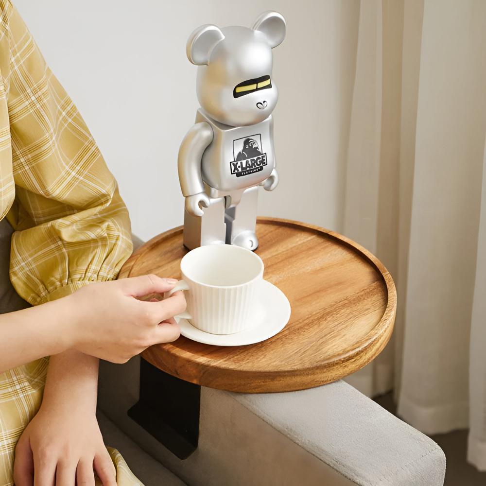Holding a cup on the wood sofa arm tray