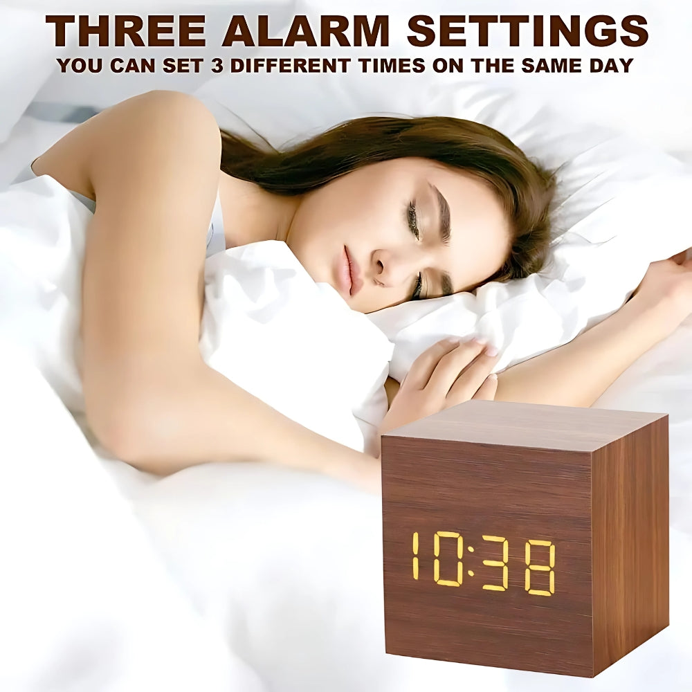 Cube LED alarm clock on a bedside table, three alarm settings