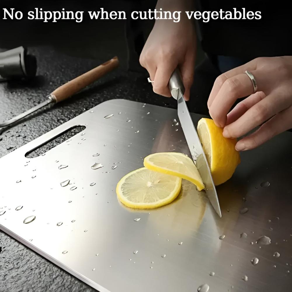 Slicing a lemon on the stainless steel cutting board