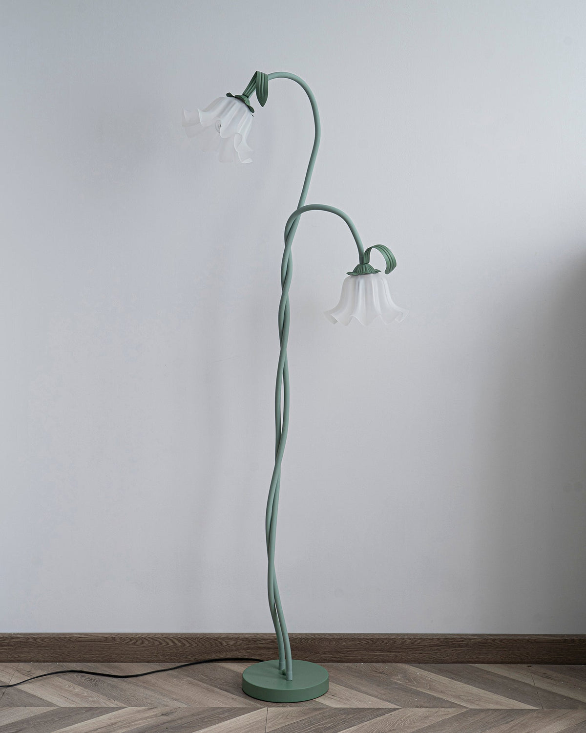 Calla lily floor lamp, green stem white shades - on a dark background, warm light