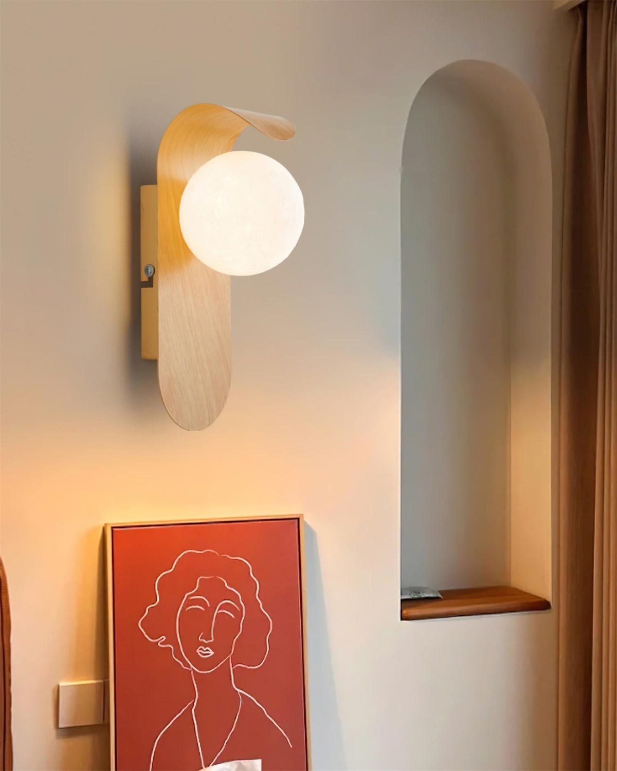 Carlyle wall lamp with frosted glass globe styled on a wooden shelf