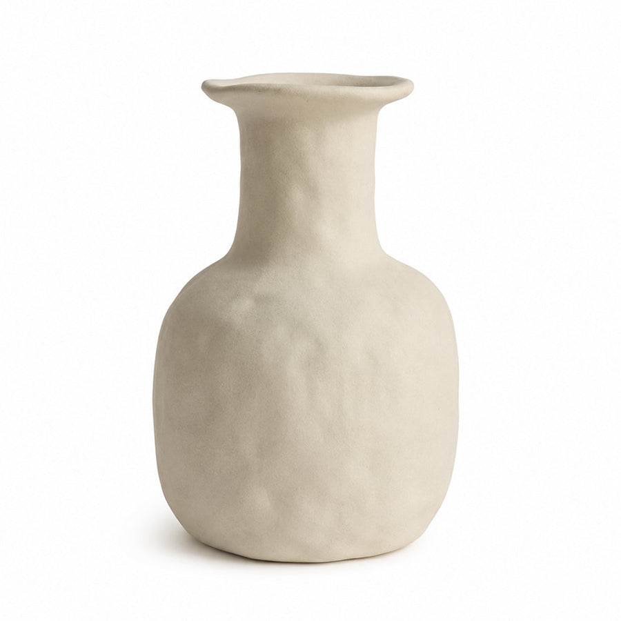 Terracotta toned unglazed ceramic vase with dried grasses