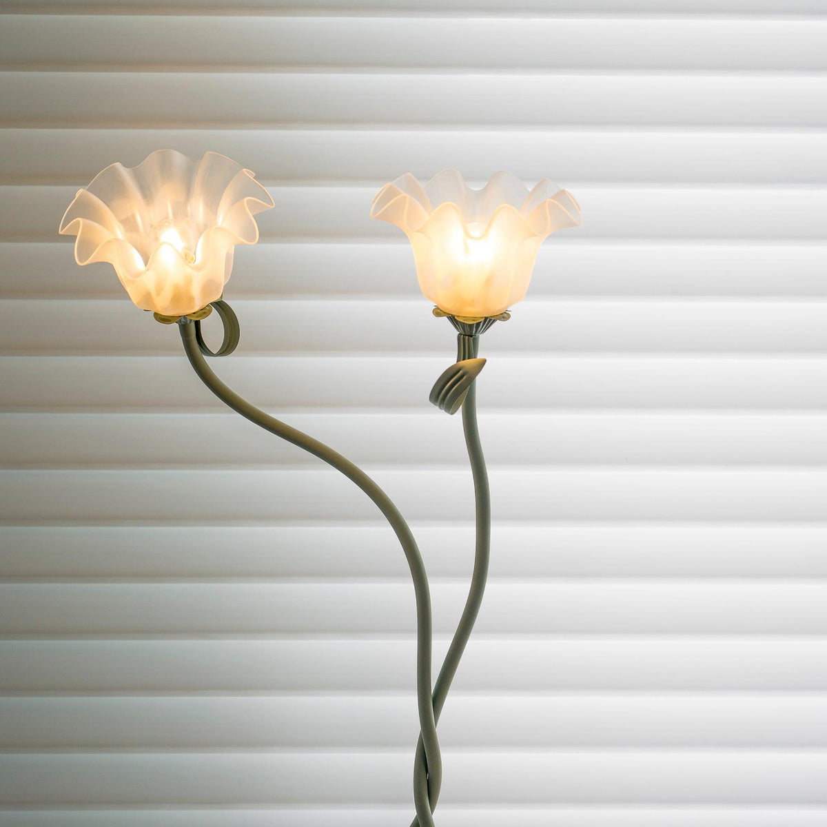 Calla lily floor lamp, green stem white shades - in a hallway