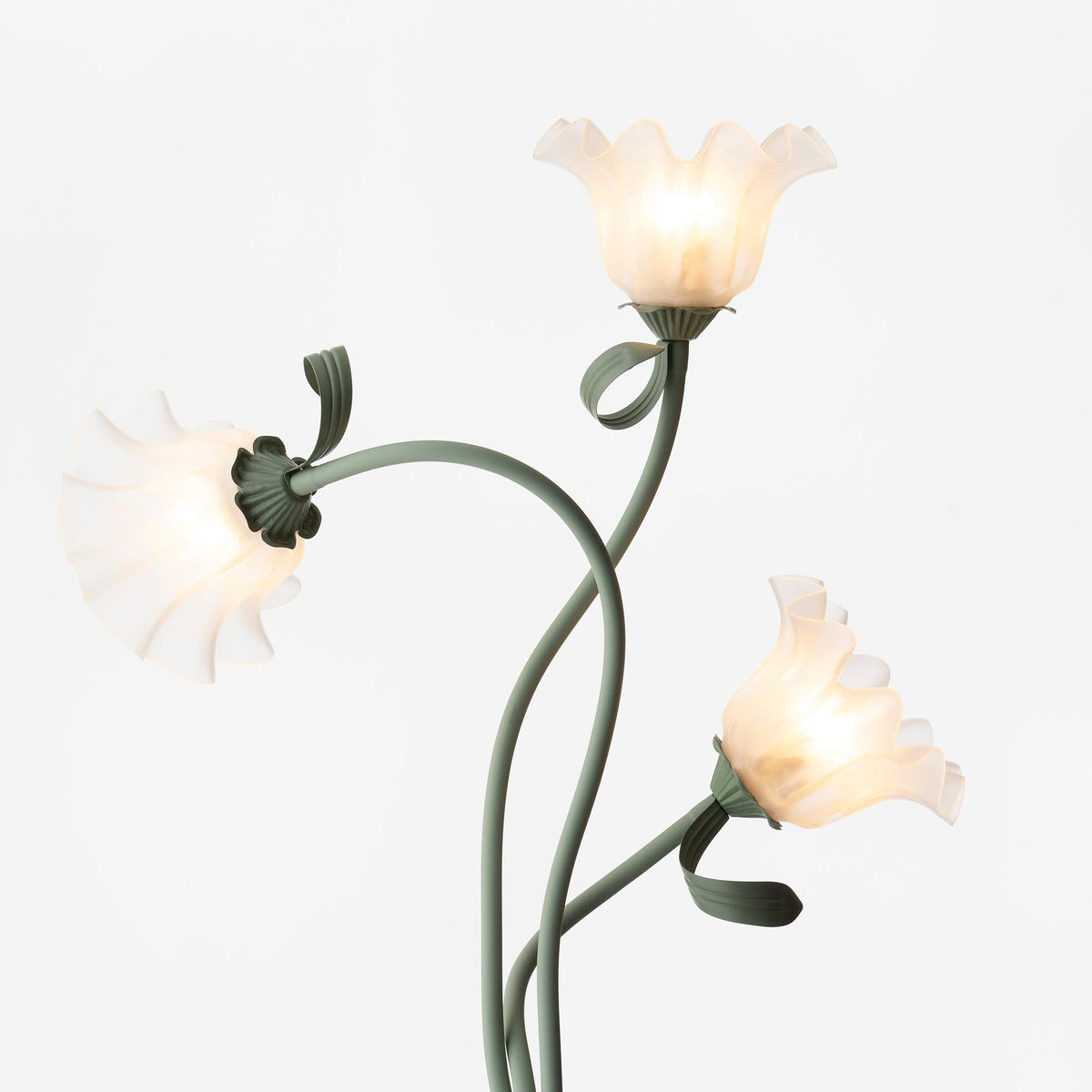 Calla lily floor lamp, green stem white shades - in a styled living room
