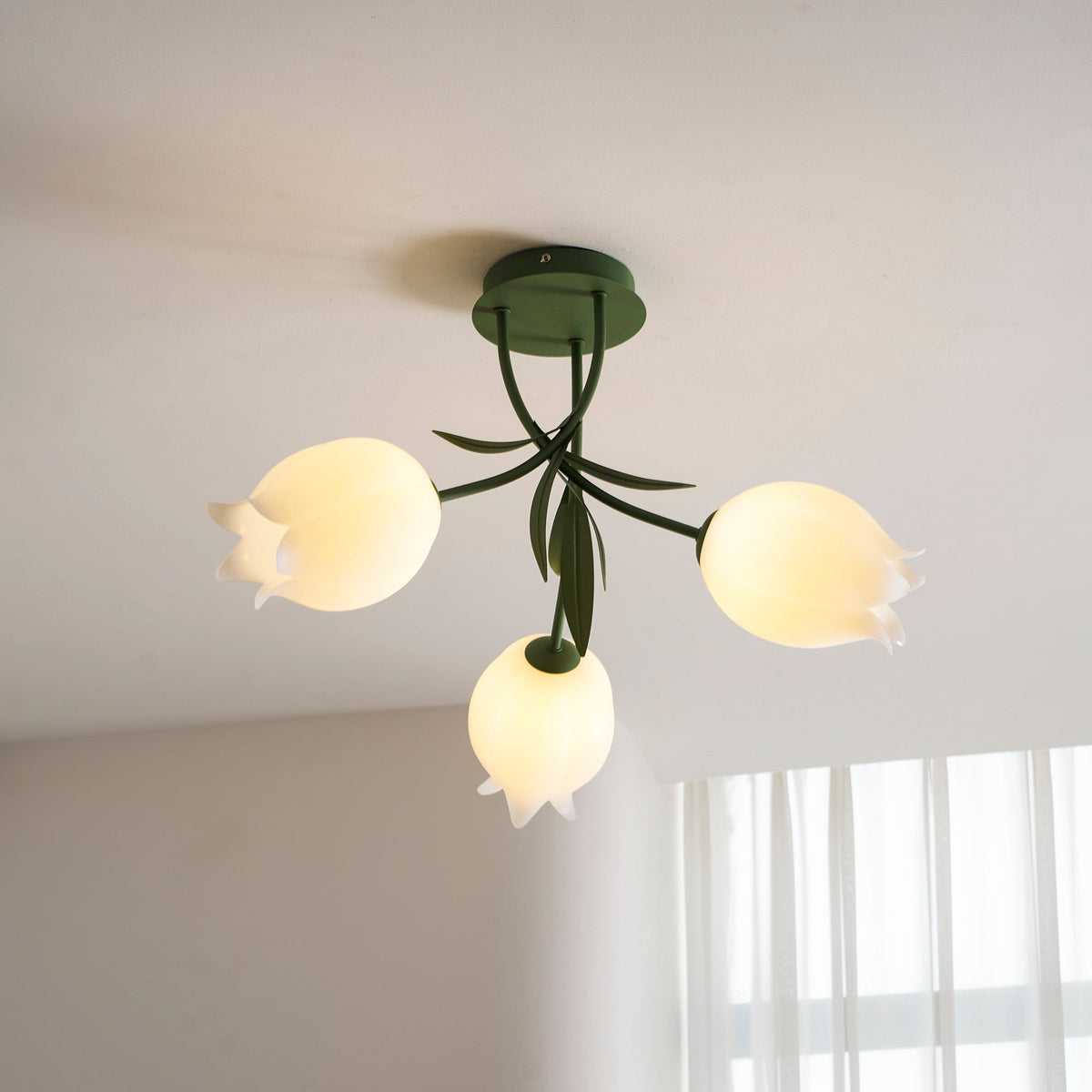 Ricko flower ceiling light, acrylic lily shades - above a dining table