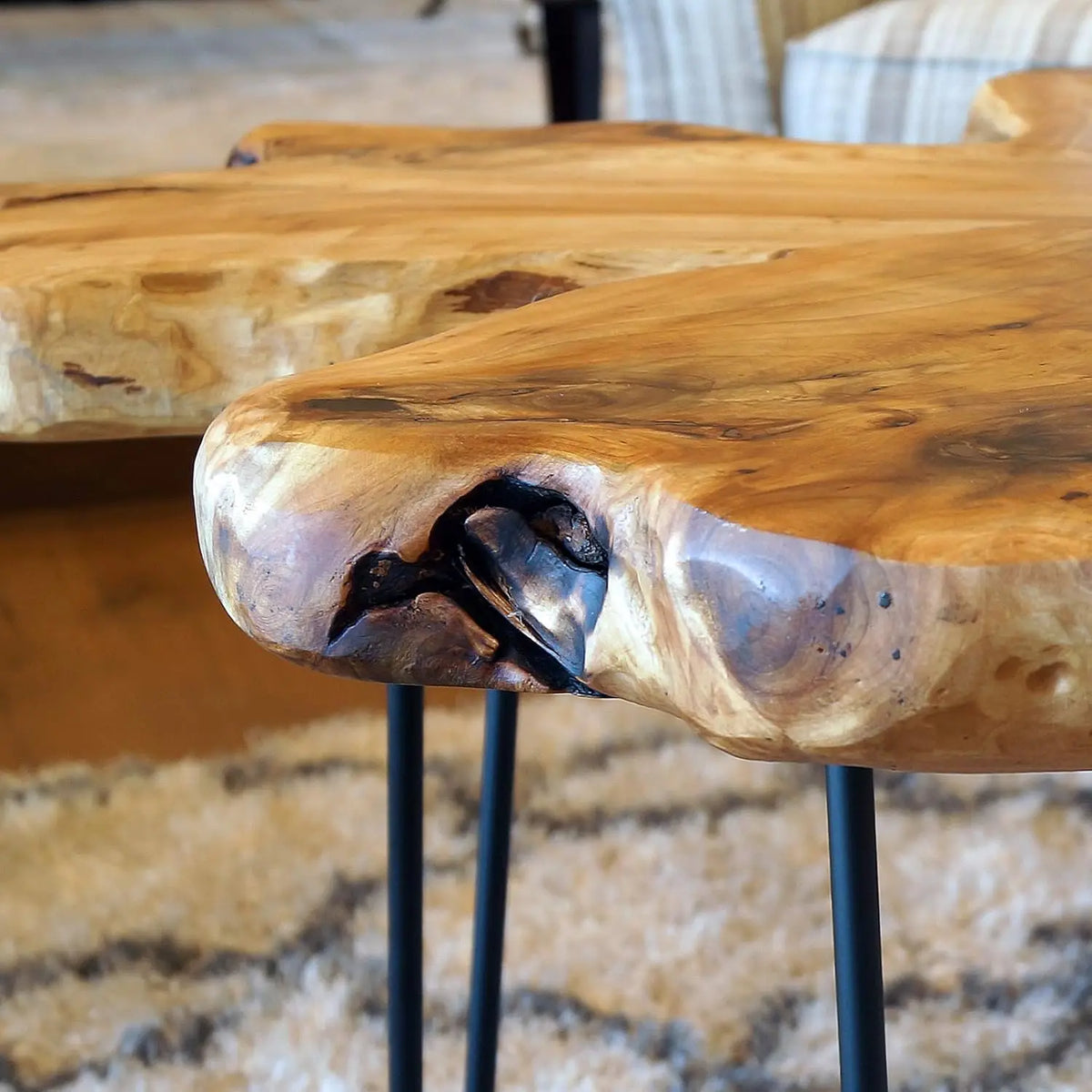 Detail of the natural edge and wood grain on the Pyraeon tabletop