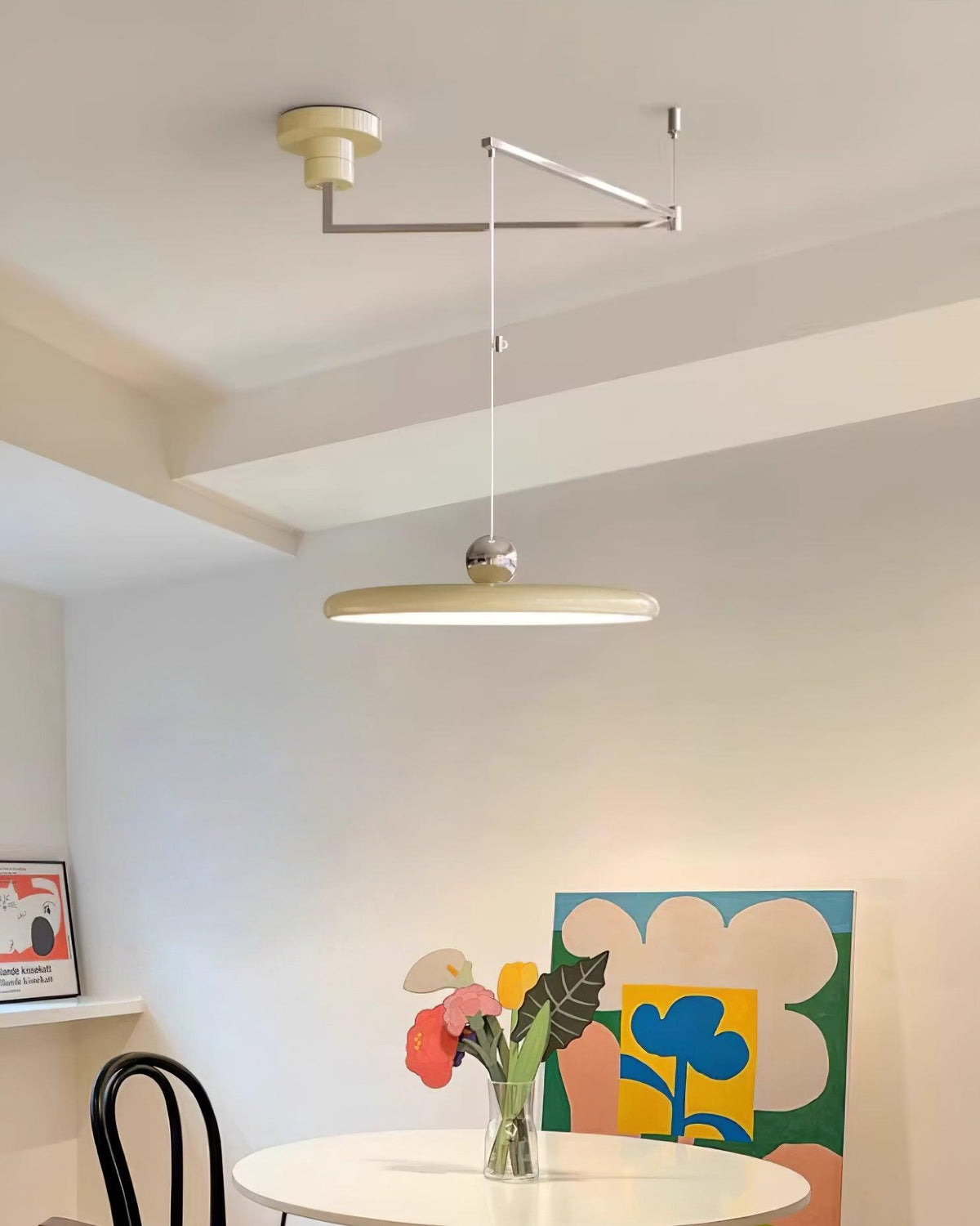 Tizio flat disc pendant light - in a styled bedroom, warm light