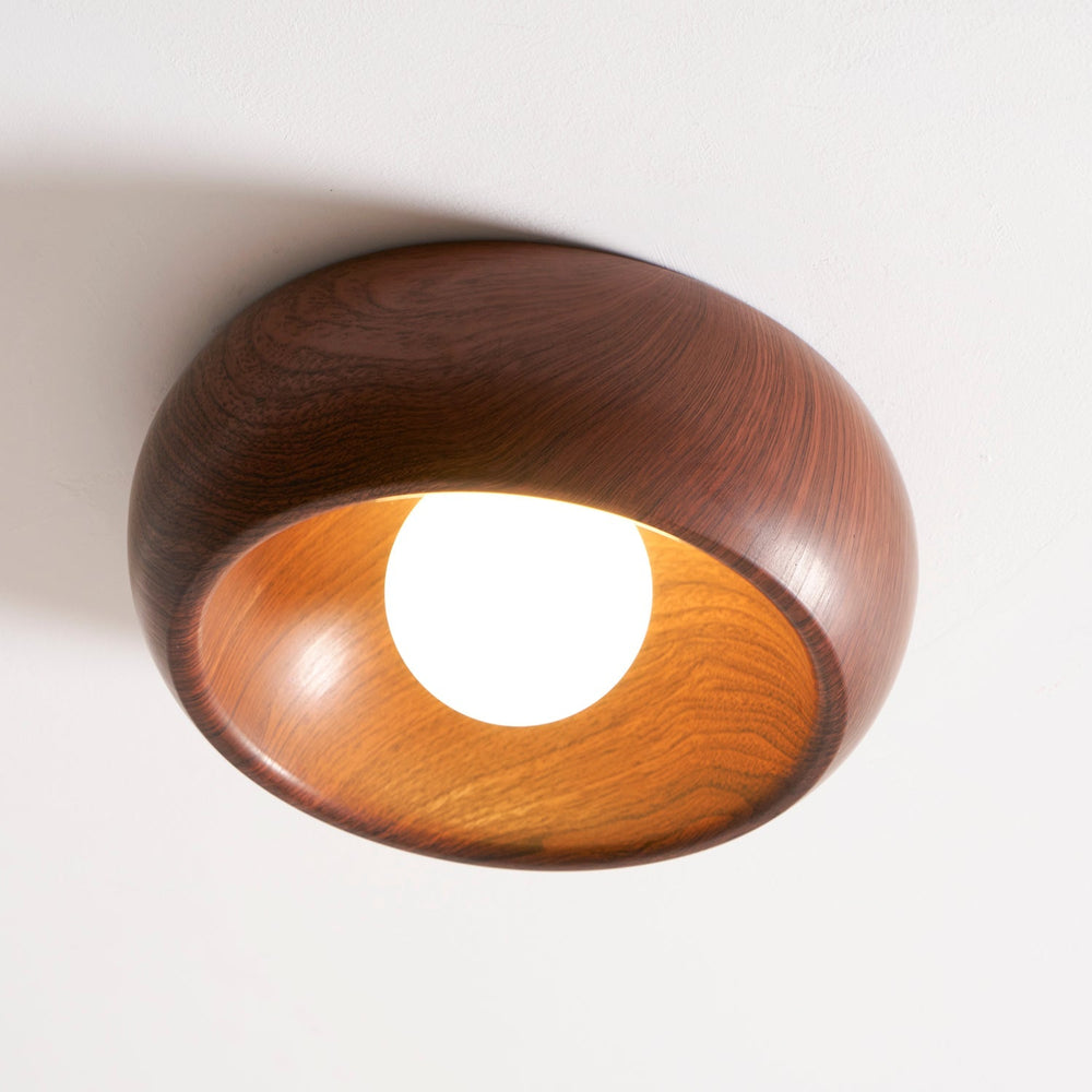 A metal shade with a wood grain finish