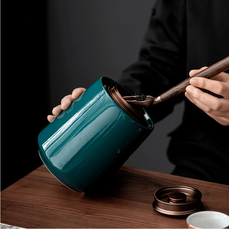 Airtight kitchen storage container with brass finish lid shown in a bright modern kitchen setting